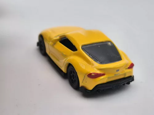 Toyota Supra - sárga -  Welly - 1:64